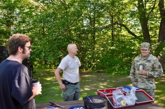 Chris & Chris discuss tent plans with a gentleman from the Vermont National Guard